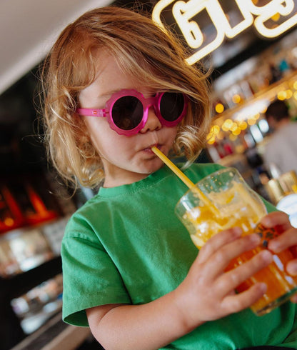 Lunettes de soleil enfant fuchsia forme fleur verres foncés Hello Hossy