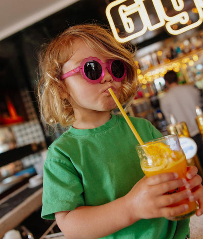 Lunettes de soleil enfant fuchsia forme fleur verres foncés Hello Hossy