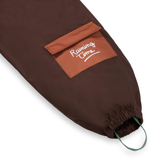 Pantalon de Pluie avec bretelles Peanut pour enfant – détail poche et élastique bas de jambe
