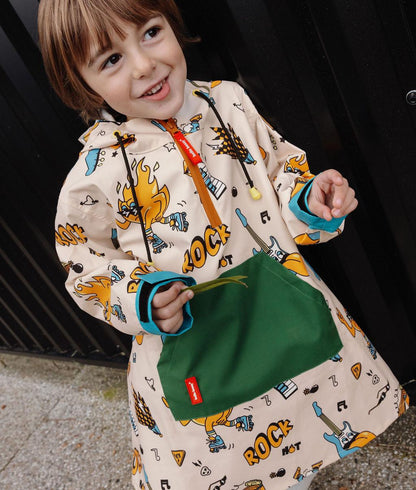 Poncho de pluie enfant crème motifs musique poche verte Hello Hossy