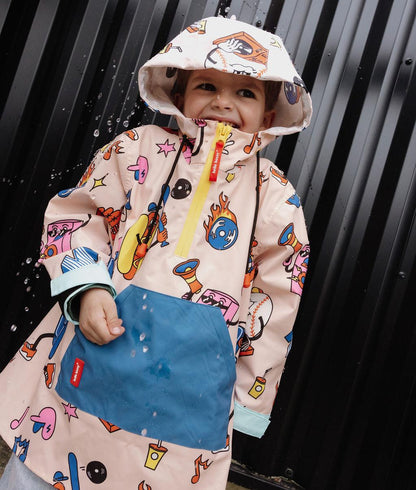 Poncho de pluie enfant crème imprimé sport bleu poche zippée Hello Hossy